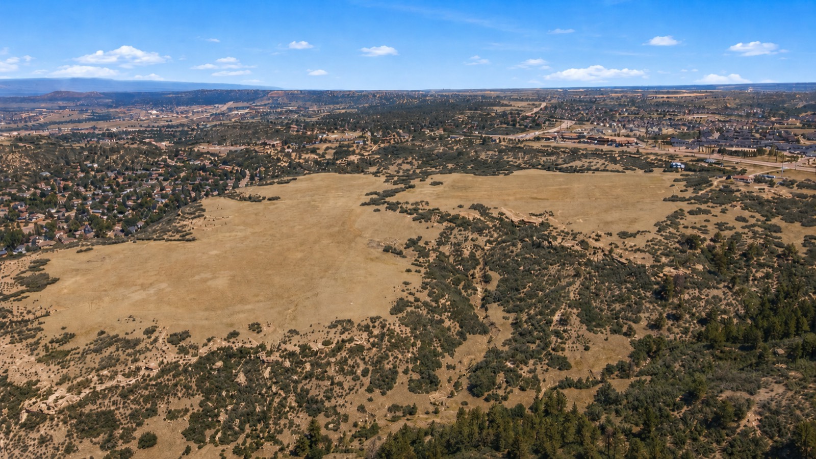 Aerial view of the property with rock outcrops and pine draws