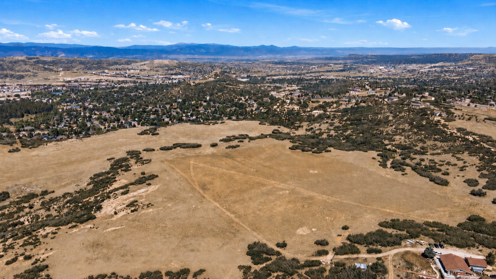 Aerial view of the property with the Front Range beyond